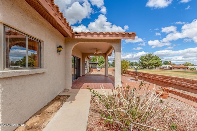 view of patio with ceiling fan