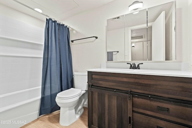 bathroom featuring vanity, wood finished floors, toilet, and shower / tub combo with curtain