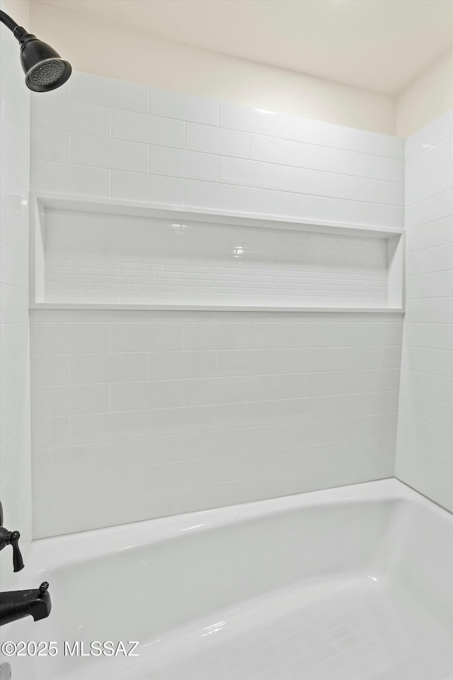 interior space featuring shower / tub combination