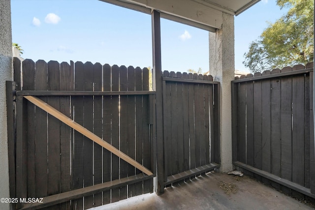 view of gate featuring fence