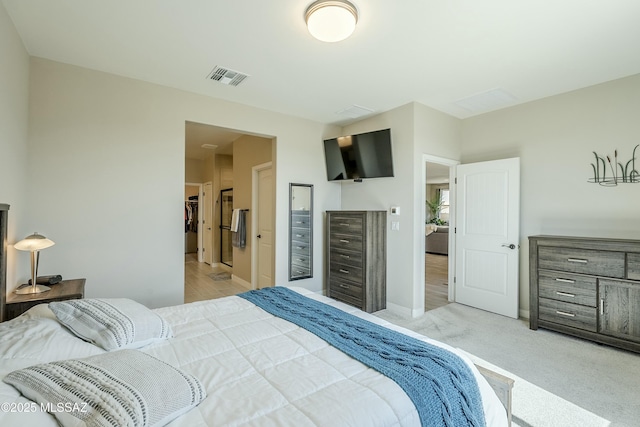 bedroom with visible vents, light colored carpet, and baseboards