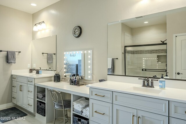 bathroom with visible vents, baseboards, vanity, and a shower stall