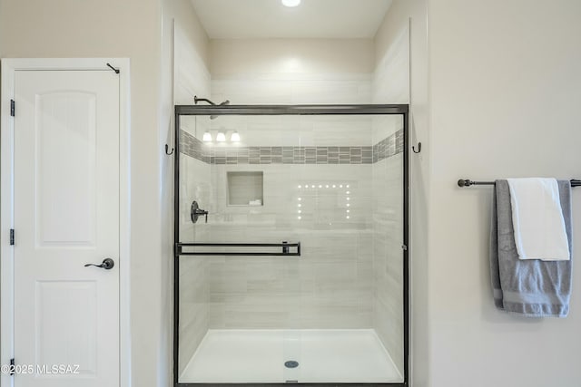 full bathroom featuring a shower stall