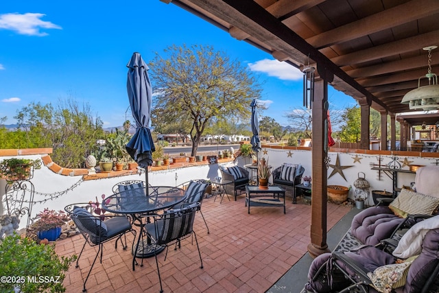 view of patio featuring outdoor dining space and an outdoor living space