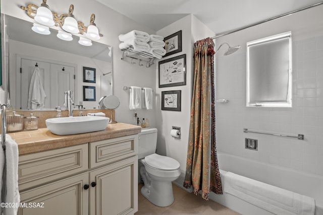 full bath featuring tile patterned floors, vanity, toilet, and shower / bathtub combination with curtain