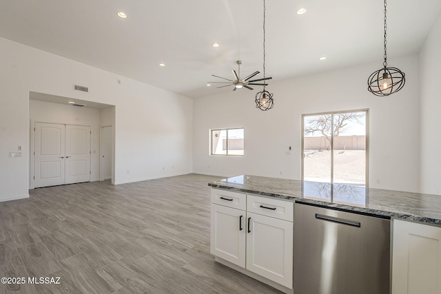 kitchen featuring recessed lighting, light wood-style flooring, stone countertops, white cabinets, and dishwasher