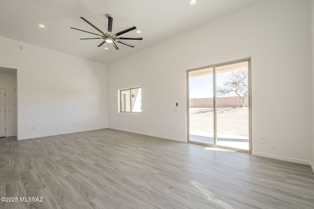 spare room with light wood-style flooring, baseboards, ceiling fan, and recessed lighting