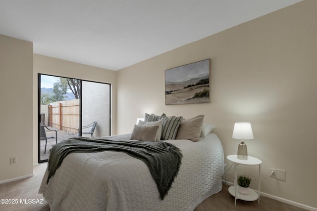 bedroom with access to outside, carpet, and baseboards