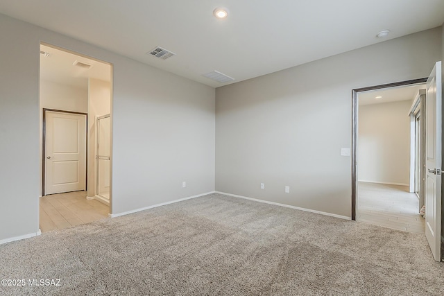 unfurnished bedroom featuring recessed lighting, visible vents, and carpet flooring