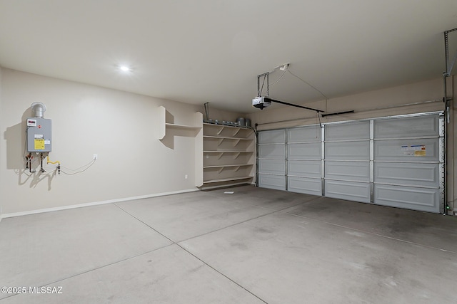 garage with a garage door opener, tankless water heater, and baseboards