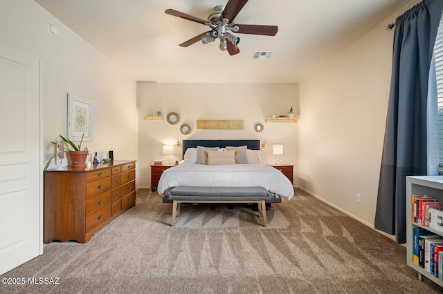 bedroom with baseboards, carpet, visible vents, and a ceiling fan