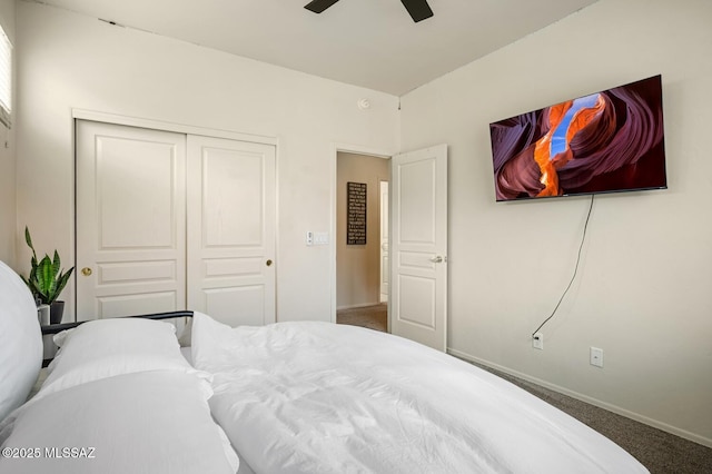 carpeted bedroom featuring a closet, ceiling fan, and baseboards