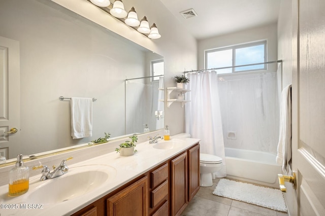 full bathroom with tile patterned flooring, shower / bathtub combination with curtain, visible vents, and a sink