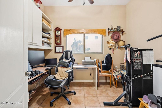 office with ceiling fan, light tile patterned flooring, and baseboards