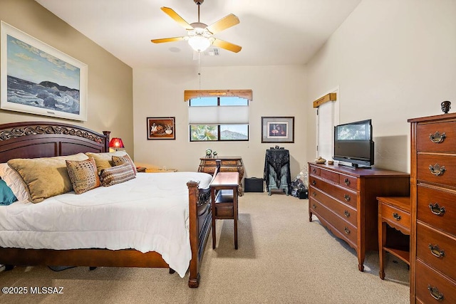 bedroom featuring ceiling fan and light colored carpet