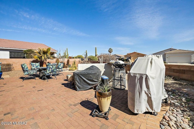 view of patio featuring grilling area and a fenced backyard