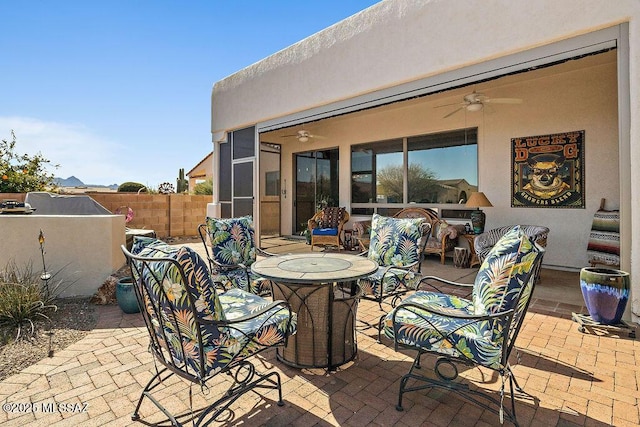 view of patio / terrace featuring ceiling fan, outdoor lounge area, and fence