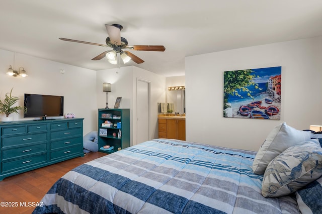 bedroom with a ceiling fan, dark wood-style flooring, and ensuite bathroom