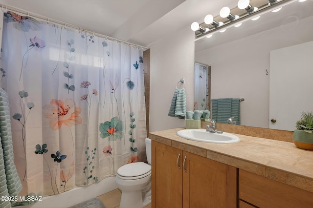 bathroom with shower / tub combo, vanity, and toilet