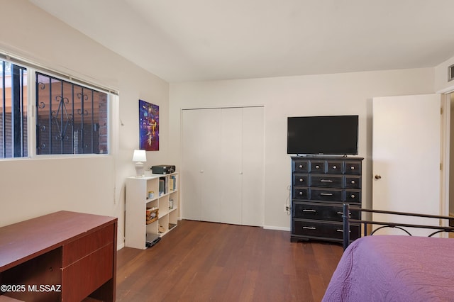 bedroom with a closet and wood finished floors