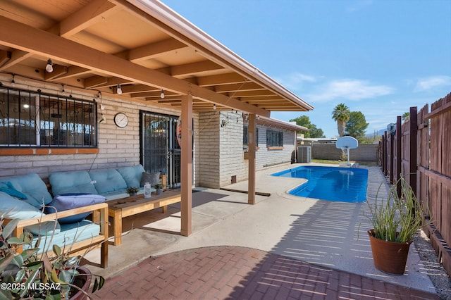 view of swimming pool with a patio area, a fenced backyard, and a fenced in pool