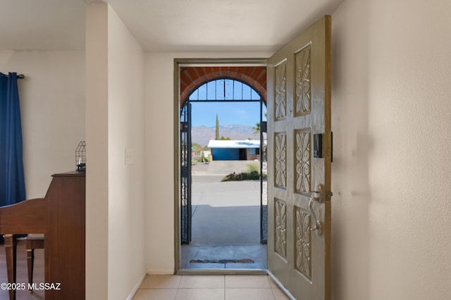 entryway featuring tile patterned flooring and baseboards