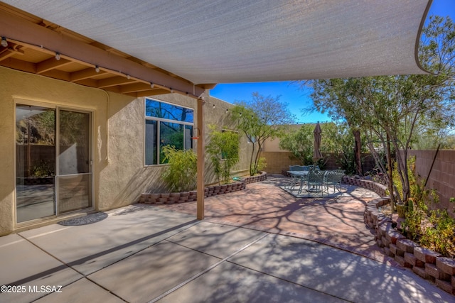 view of patio / terrace featuring outdoor dining space and a fenced backyard