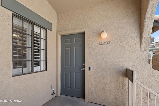 101 S Players Club Dr Unit 11202, Tucson, AZ 85745 - view of exterior entry featuring stucco siding