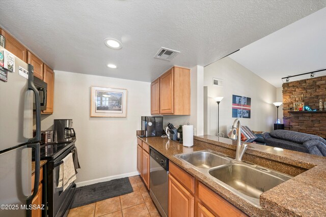 101 S Players Club Dr Unit 11202, Tucson, AZ 85745 - kitchen with light tile patterned floors, visible vents, appliances with stainless steel finishes, and a sink