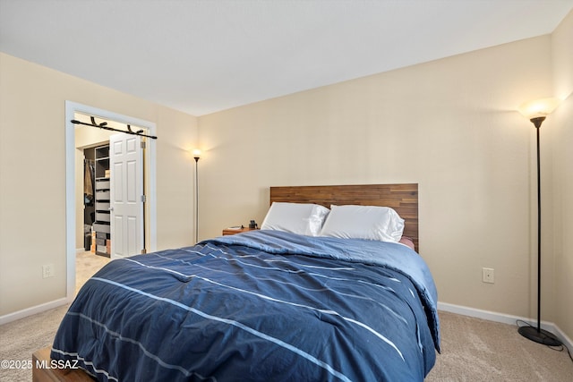 101 S Players Club Dr Unit 11202, Tucson, AZ 85745 - bedroom featuring carpet flooring, a walk in closet, and baseboards