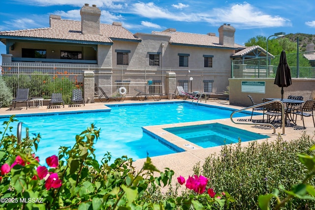 101 S Players Club Dr Unit 11202, Tucson, AZ 85745 - community pool with a community hot tub, fence, and a patio