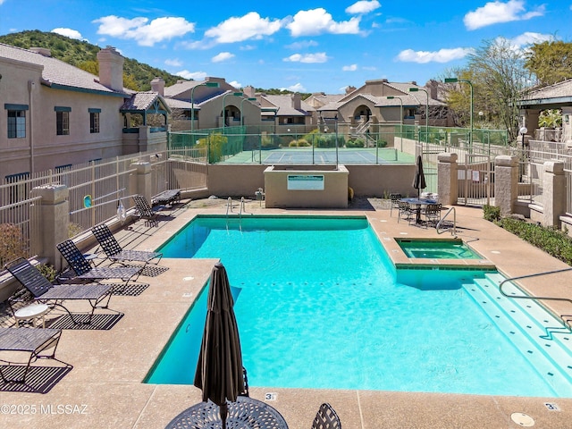 101 S Players Club Dr Unit 11202, Tucson, AZ 85745 - pool with a patio, fence, a residential view, and a hot tub