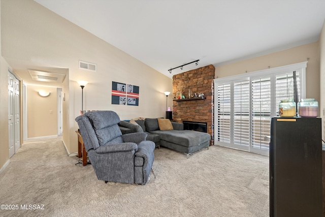 101 S Players Club Dr Unit 11202, Tucson, AZ 85745 - living room featuring carpet, visible vents, vaulted ceiling, and track lighting