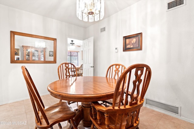 dining area with light tile patterned floors and visible vents