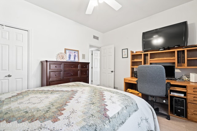 carpeted bedroom with visible vents and ceiling fan