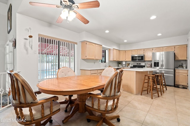 dining area with light tile patterned flooring, recessed lighting, and a ceiling fan