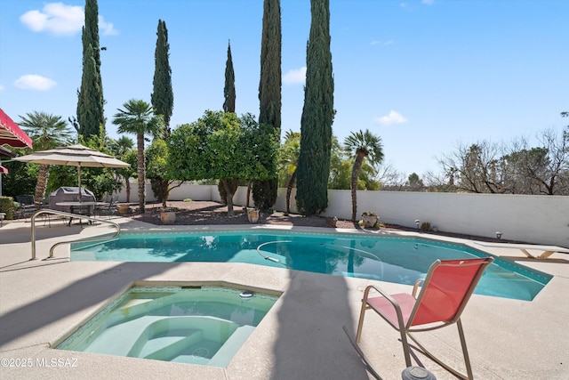 view of swimming pool with a patio, a fenced in pool, an in ground hot tub, a fenced backyard, and a diving board