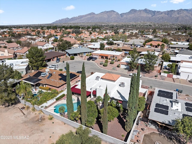 birds eye view of property with a mountain view and a residential view