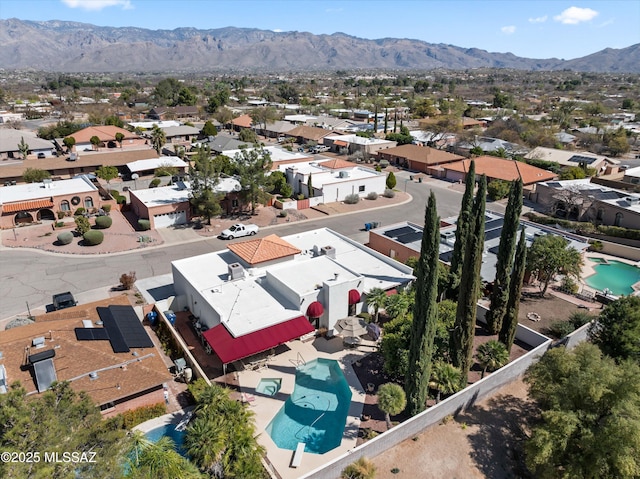 drone / aerial view featuring a mountain view and a residential view