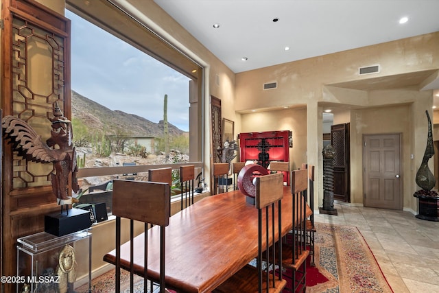 dining area with visible vents, baseboards, a mountain view, and recessed lighting