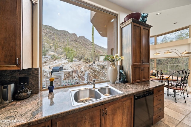 kitchen featuring a sink, a mountain view, and dishwasher