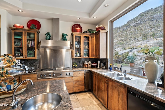 kitchen with dishwasher, a sink, and decorative backsplash