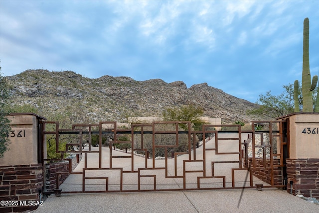 view of gate featuring a mountain view