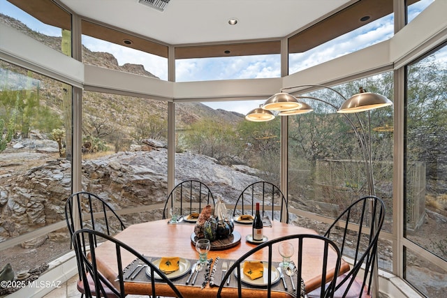 sunroom / solarium featuring visible vents