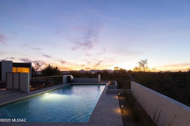 outdoor pool featuring fence