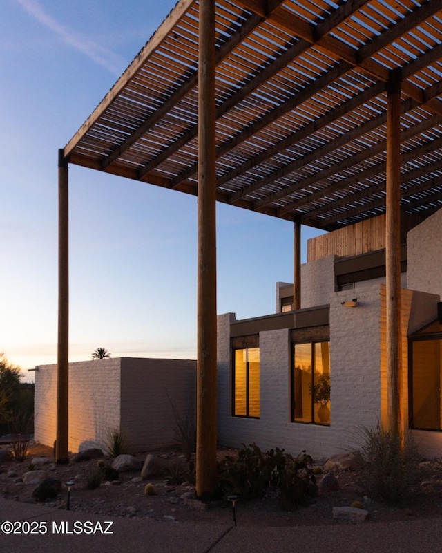 view of home's exterior with a pergola