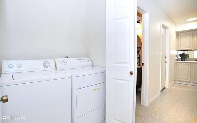 clothes washing area with laundry area and washer and dryer