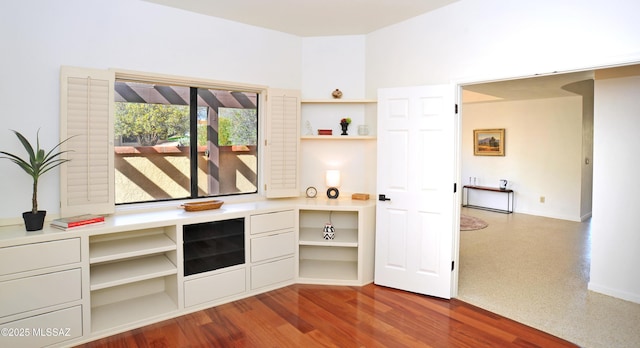 unfurnished office with dark wood-style floors