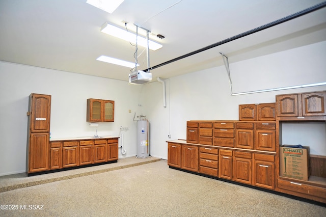 garage featuring water heater, baseboards, and a garage door opener