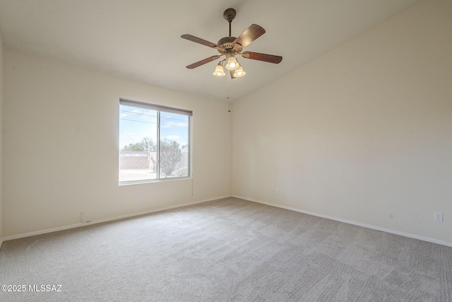 unfurnished room featuring carpet floors, ceiling fan, baseboards, and vaulted ceiling